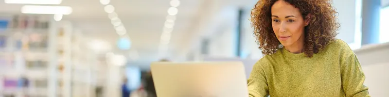 Mature student in college library