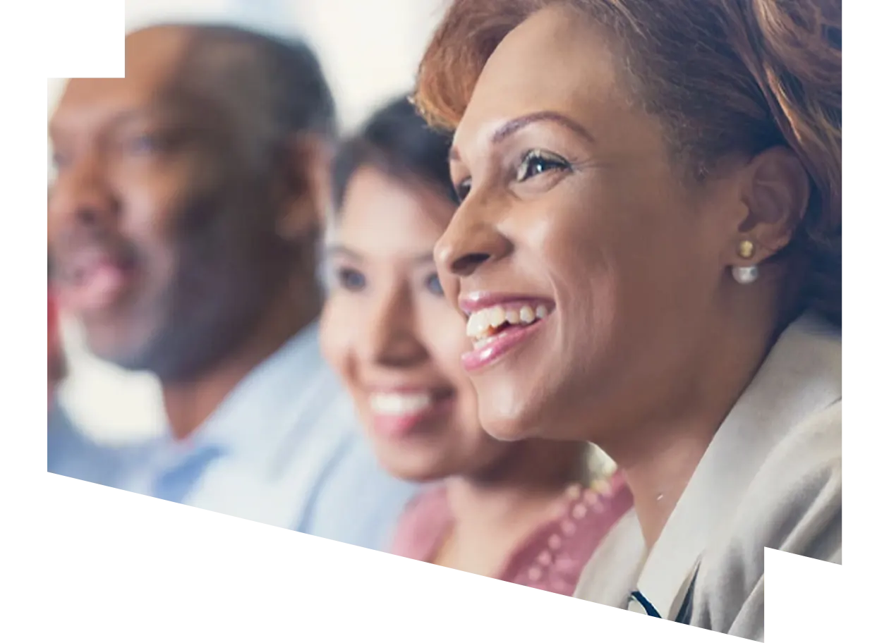 Close-up of smiling people at a conference