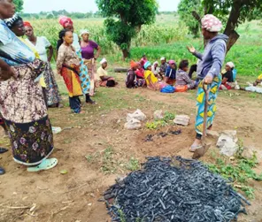 Women from Dzaleka Refugee Camp participating in a MAGUFINA community session.