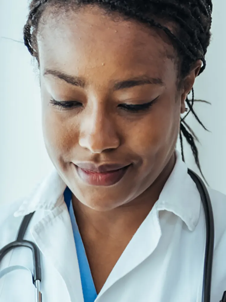Physician on ipad - decorative circle pattern around her