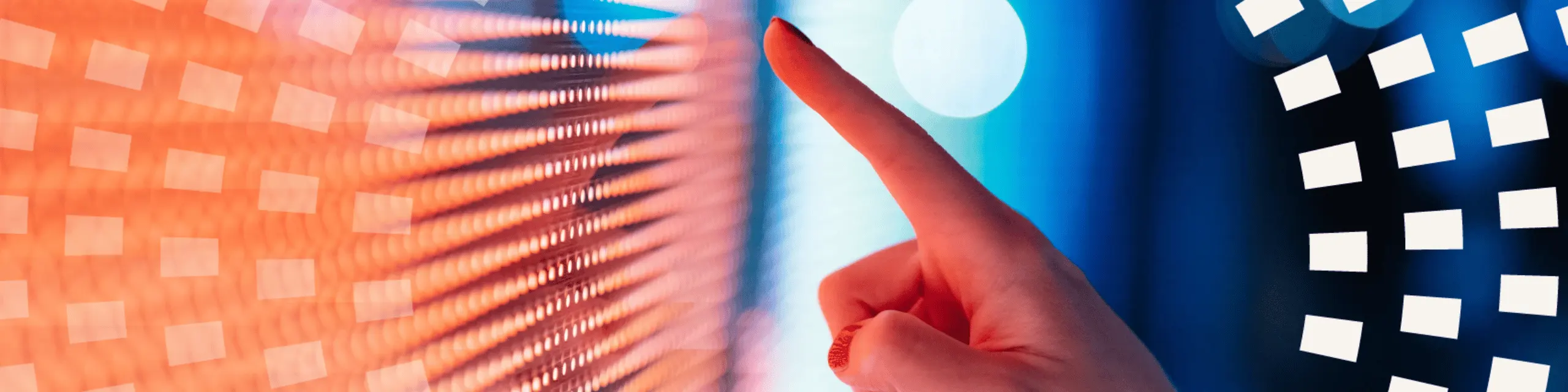 A finger pointing into a screen