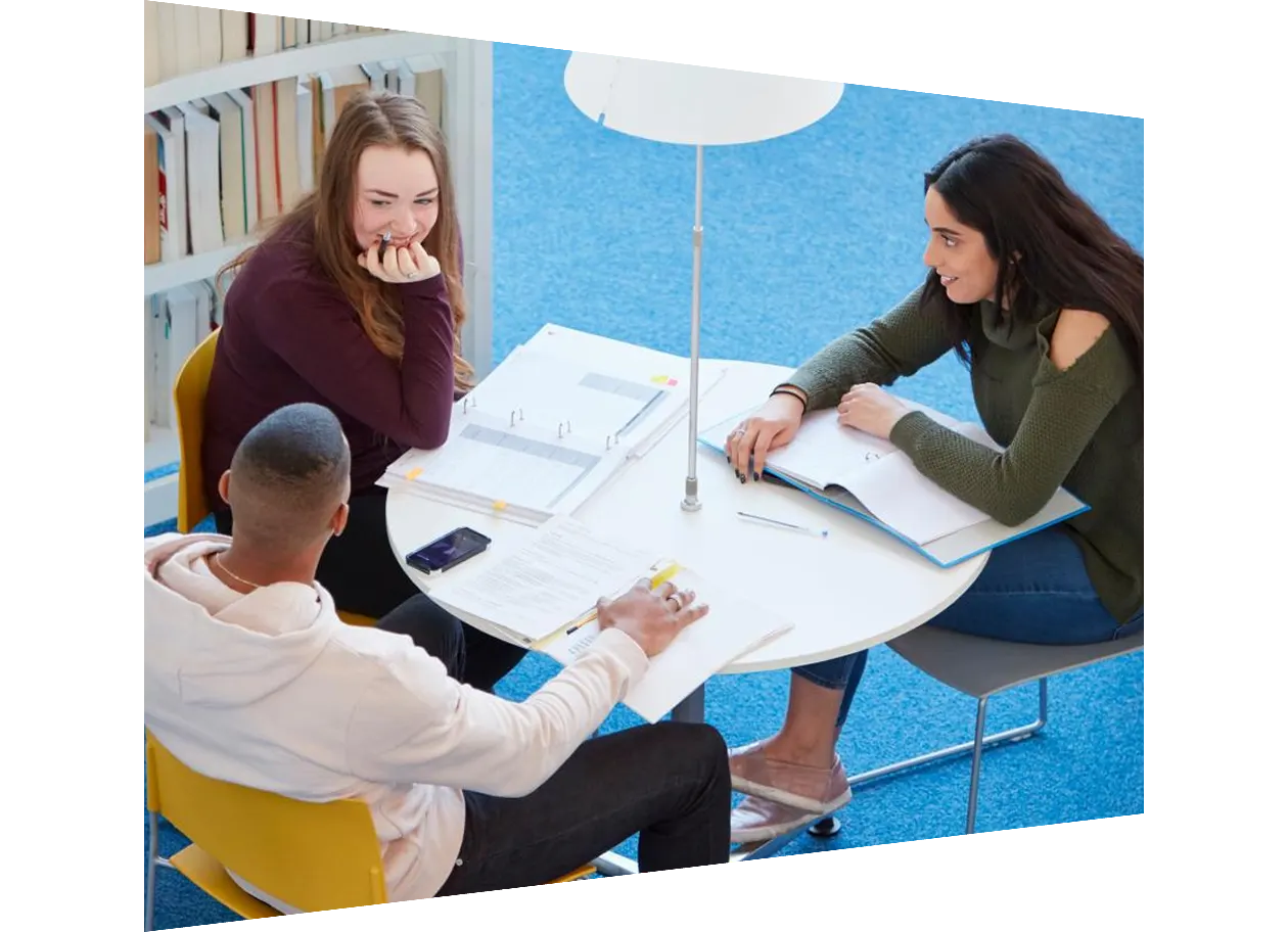 Colleagues working on projects around table