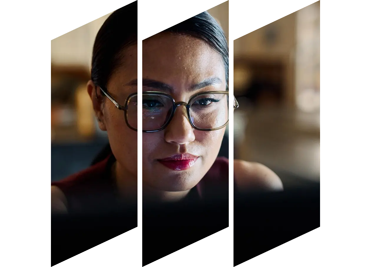 Asian woman concentrating while looking at her computer screen
