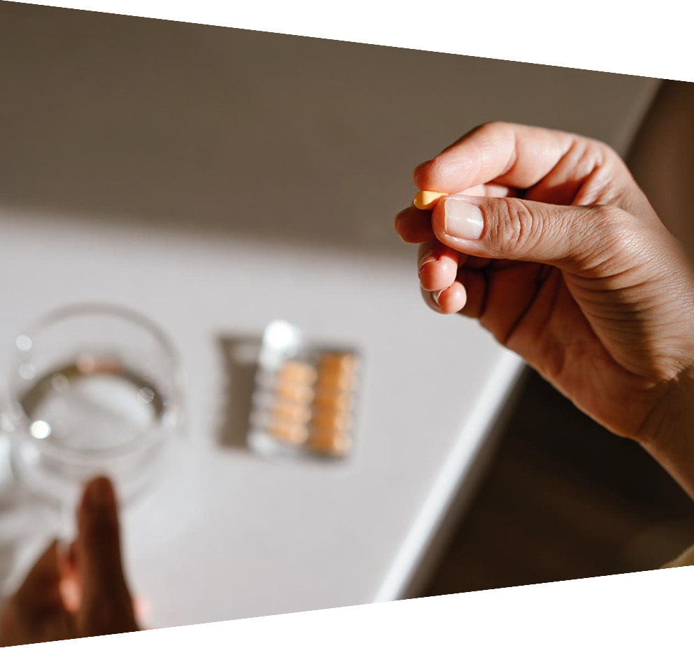 Close-up of hand holding pill