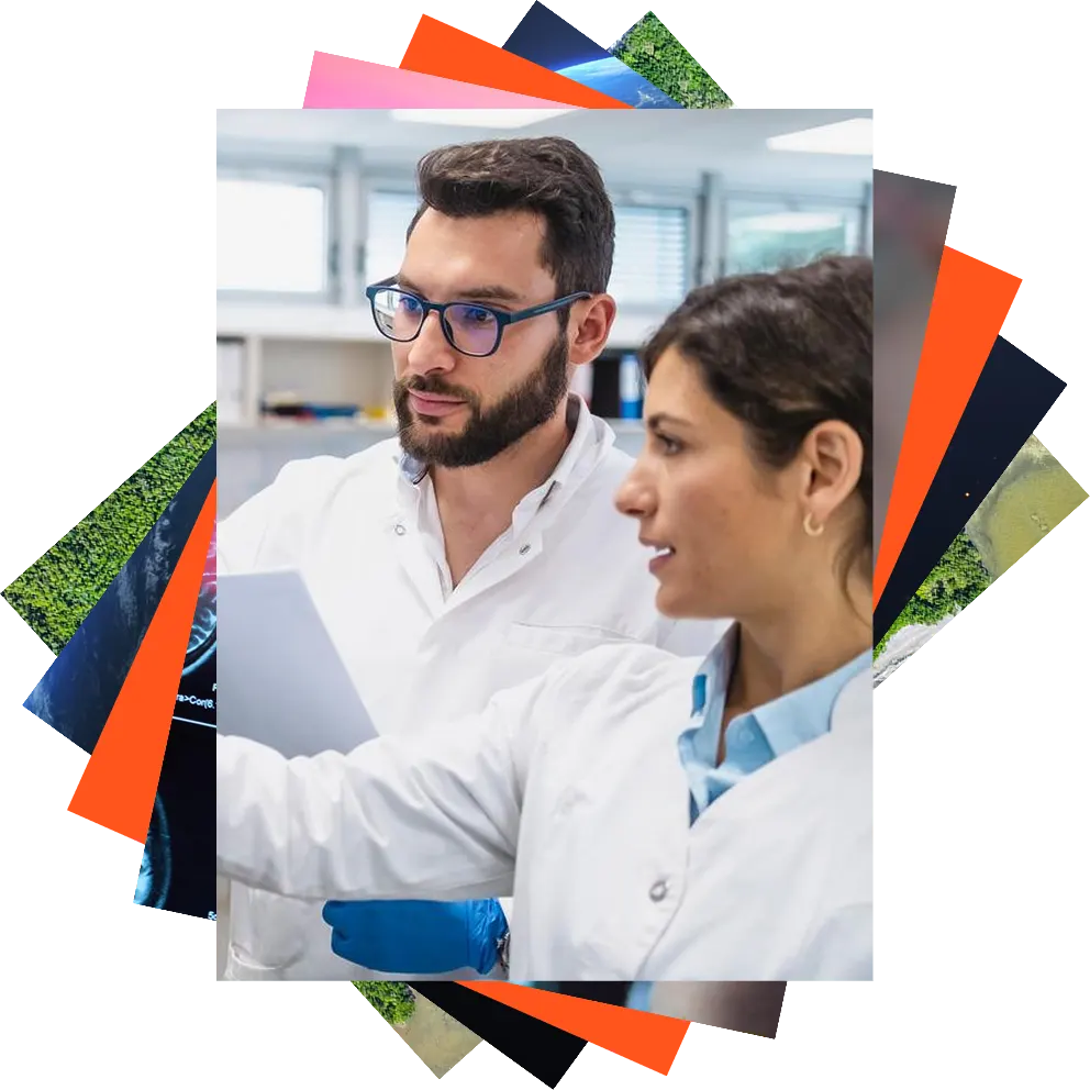A researcher wearing a lab coat studies plants.