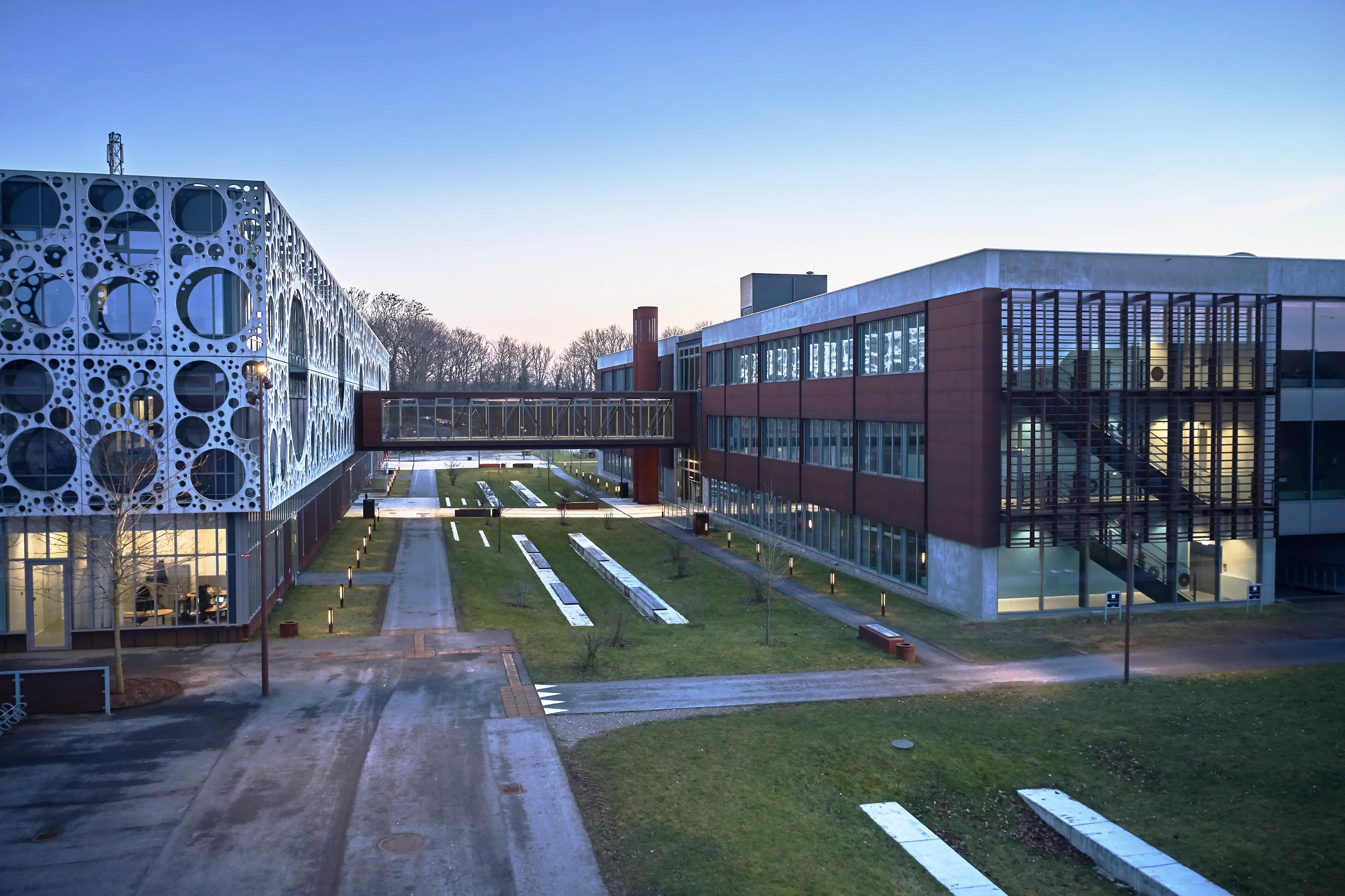 Photograph of two campus buildings connected by a enclosed bridge