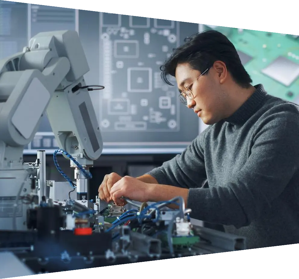 Asian male engineer building a robotic hand