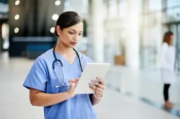 doctor looking at the ipad