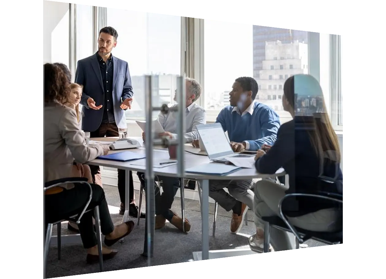 Man drawing on glass whiteboard