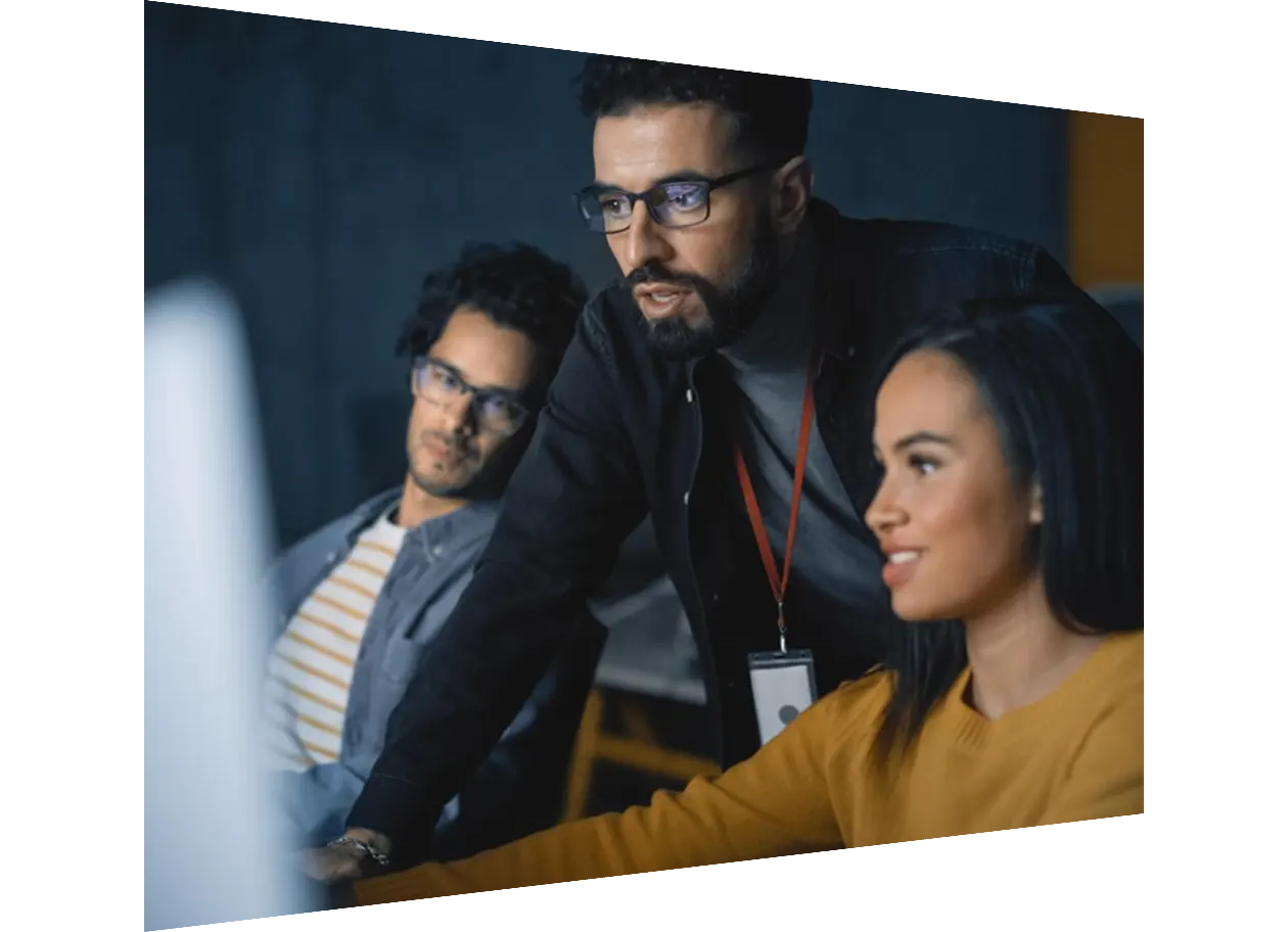 Teacher giving lesson to diverse group of students in college
