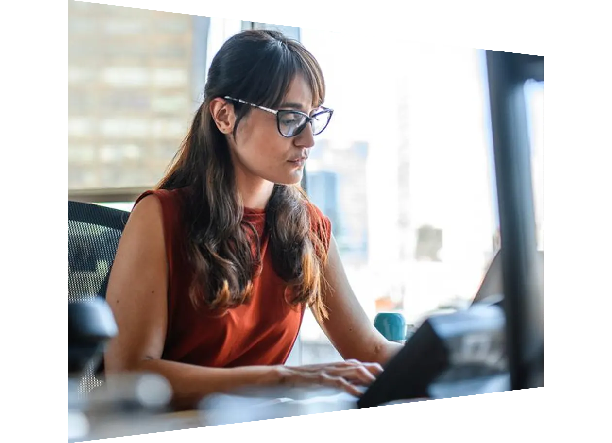 Female author working on laptop in office