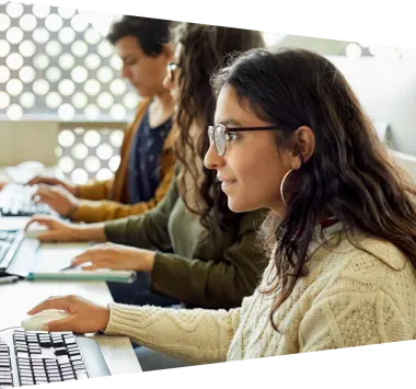 Woman with glasses working on computer