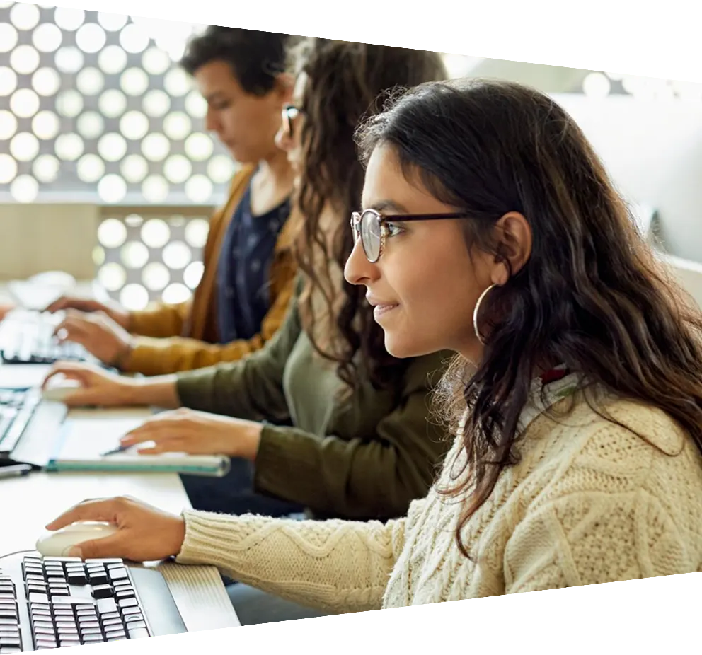 Woman with glasses working on computer