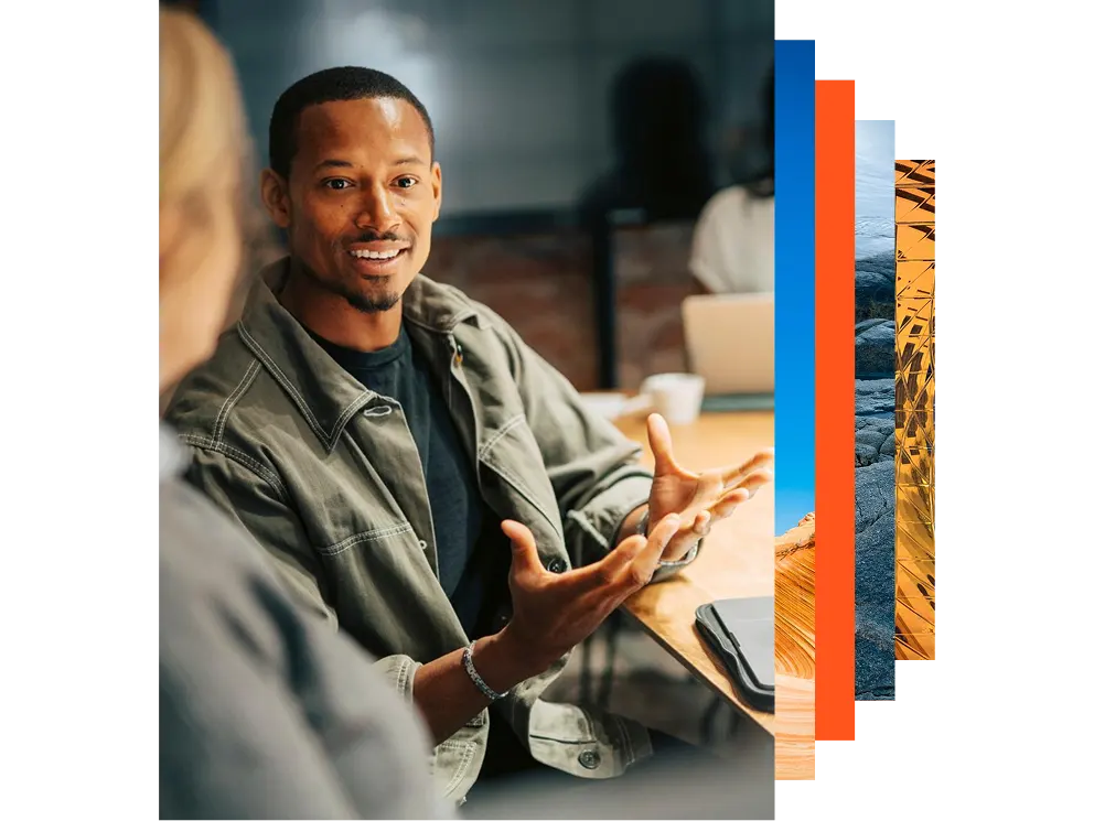 Young businessman explaining strategies to colleagues in a meeting