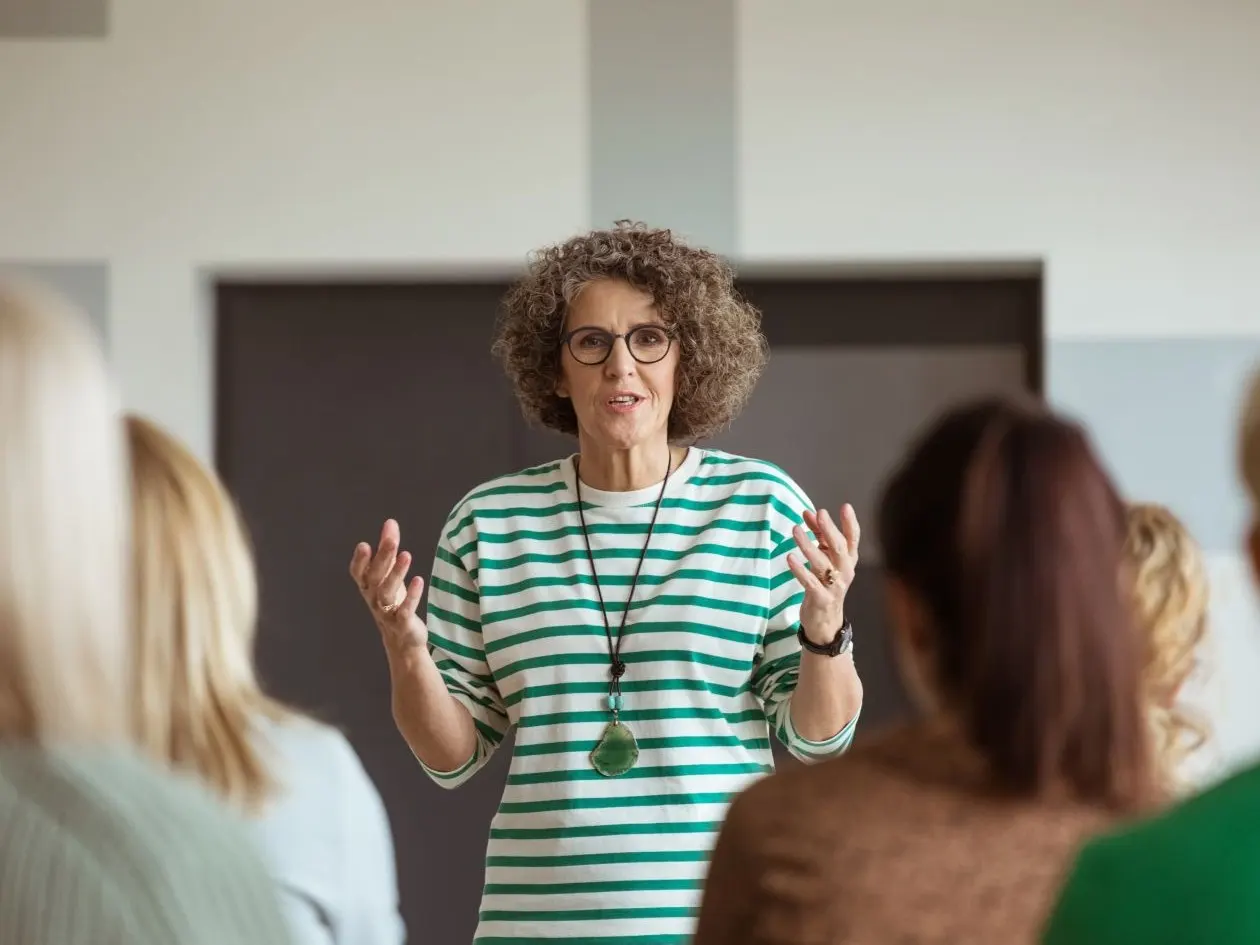 Woman sharing experience during seminar