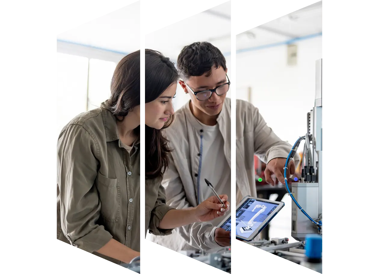 Two students in conversation with chalkboard in background