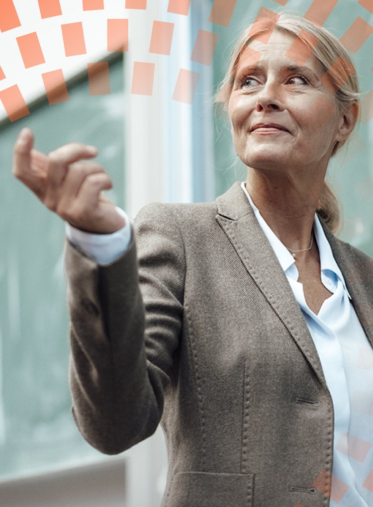 Businesswoman giving presentation by chalkboard at convention center