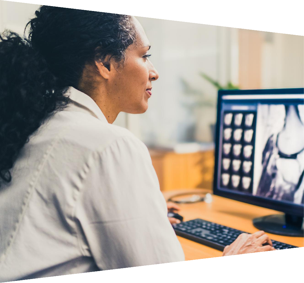 Clinicians reviewing digital medical imagery