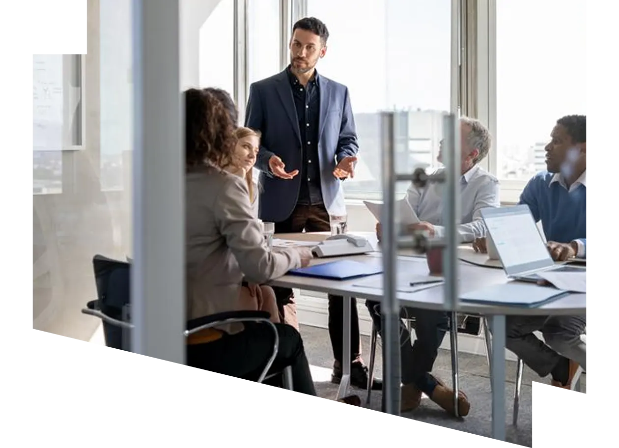 Businesswoman and business man reviewing paperwork together