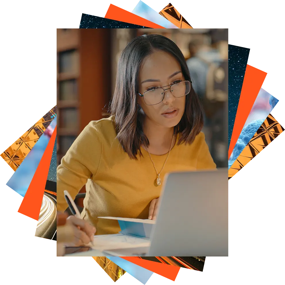 Woman looking at computer, reflection in her glasses