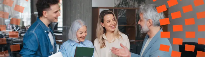 A group of professionals talking around with diverse colleagues
