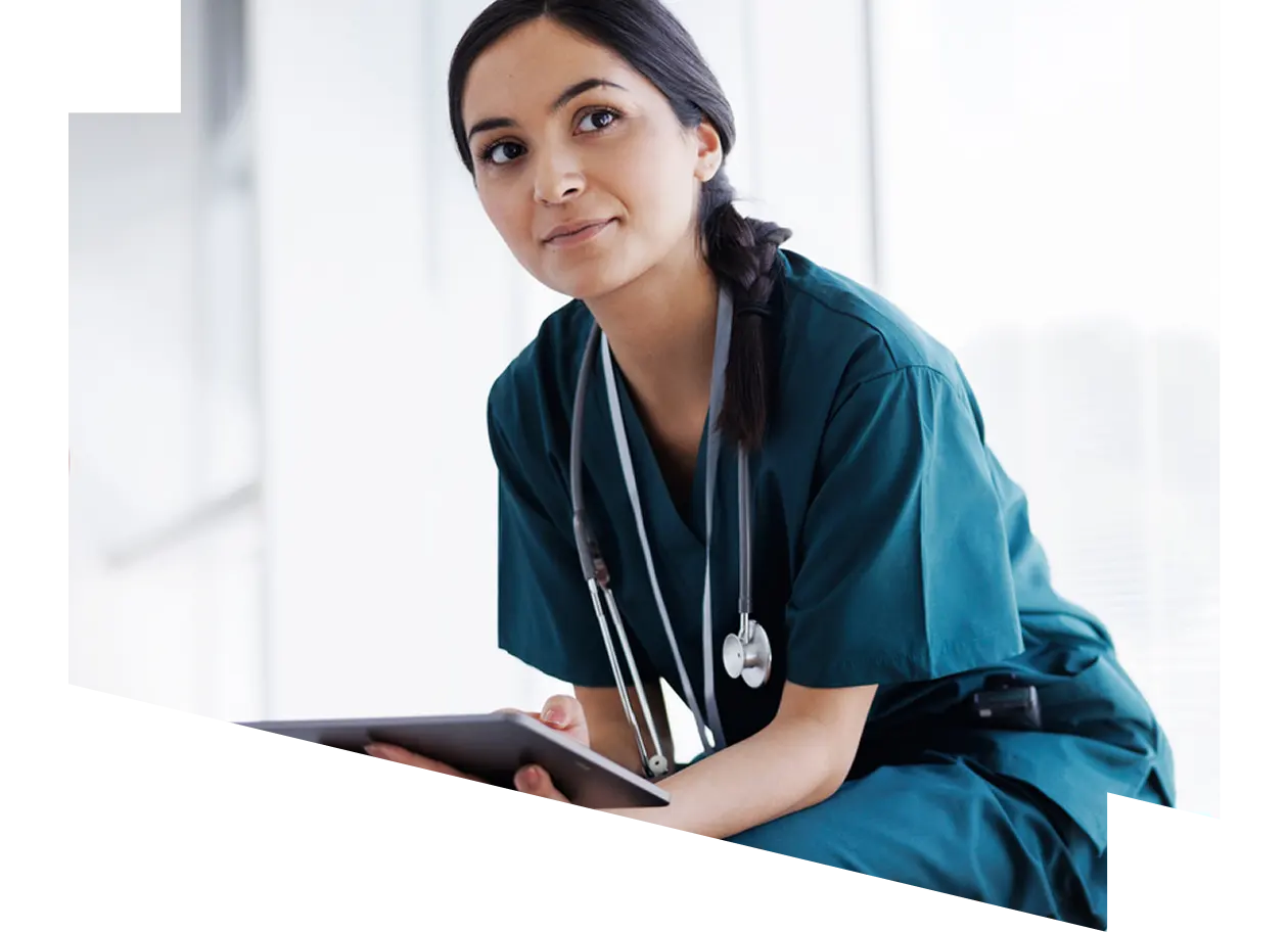 Female healthcare professional looking at a digital tablet