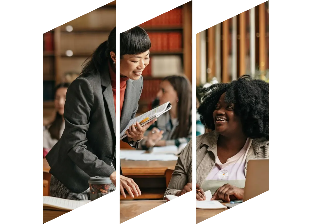 Japanese professor standing next to student explaining science principals