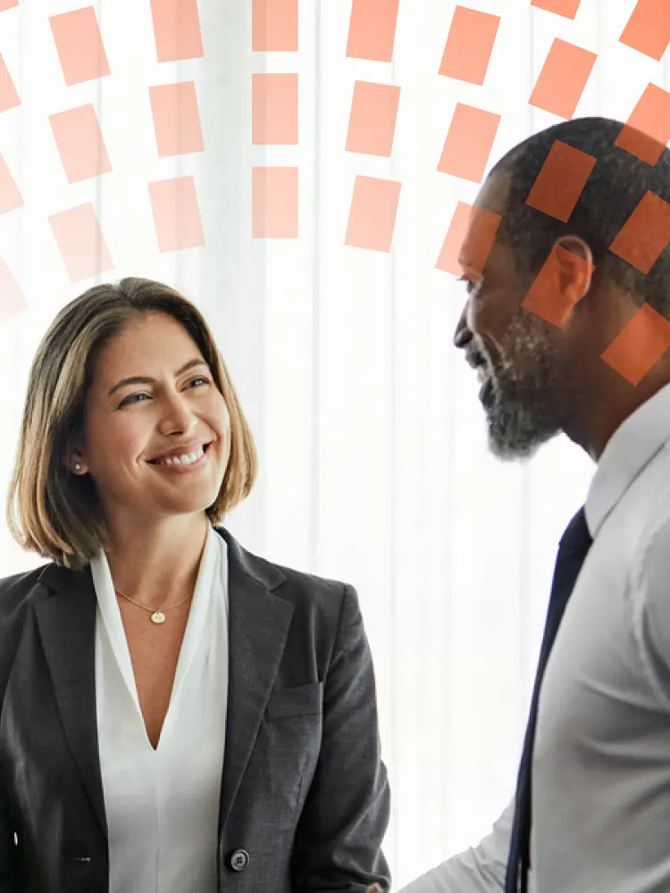 Two colleagues chatting and walking