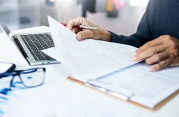 Scientist reviewing an article