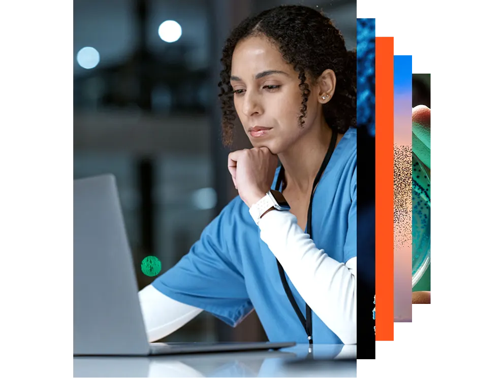 Smiling nurse and doctor looking at a laptop together