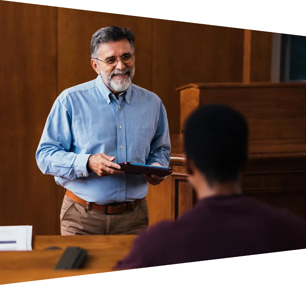Professor Engaging with Students in Lecture Hall Setting