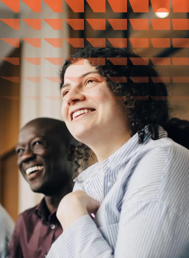 Smiling male and female business colleagues in meeting at office