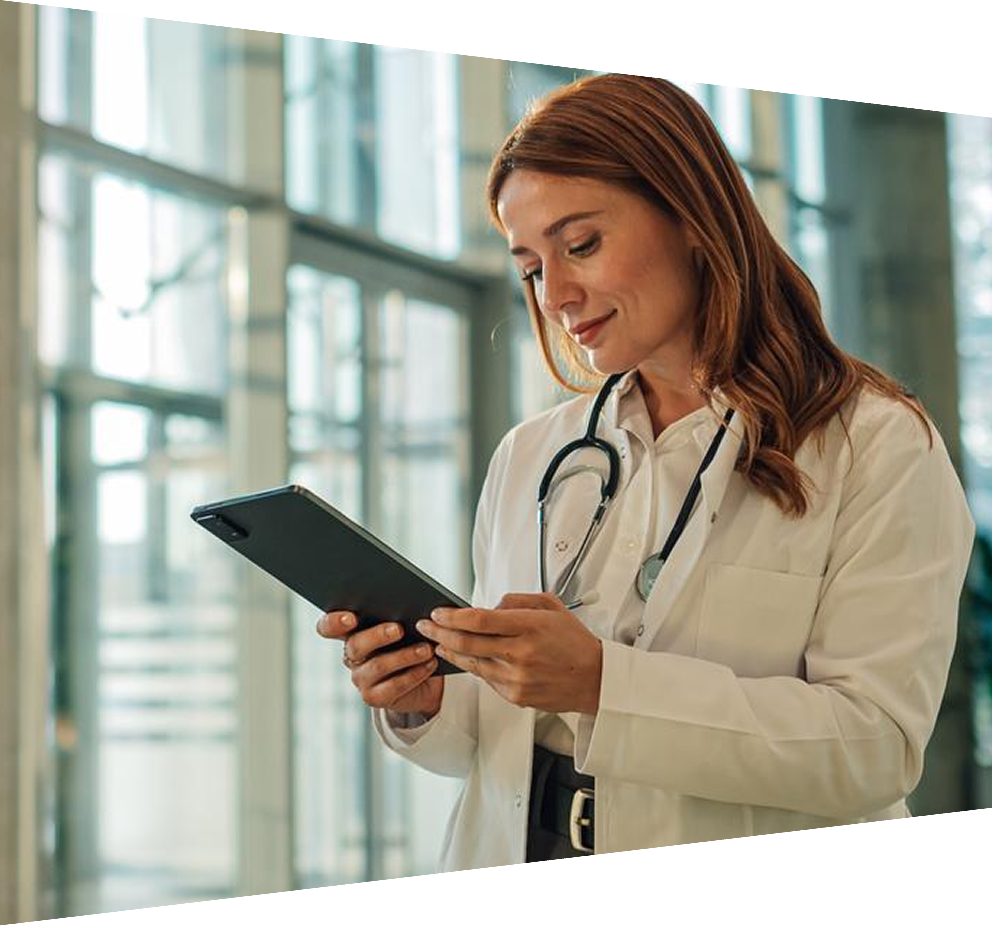 Female doctor using digital tablet in modern hospital lobby