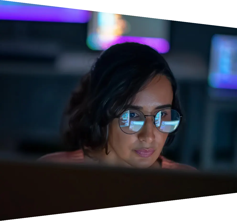 Software developer working on computer in research center
