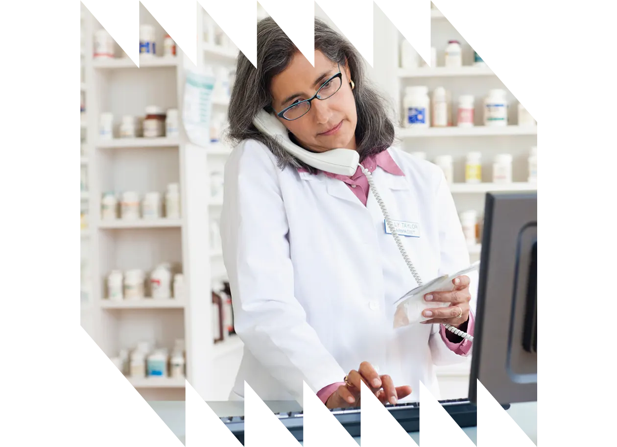 Pharmacist clinic handing medication to patient