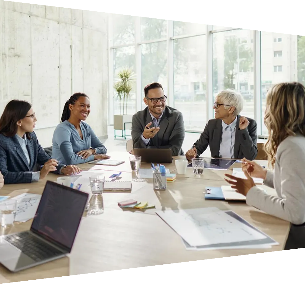 Team of happy entrepreneurs talking on a meeting in the office