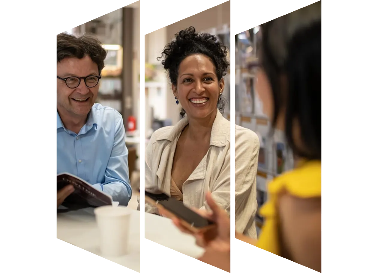 Smiling librarian talking to colleague
