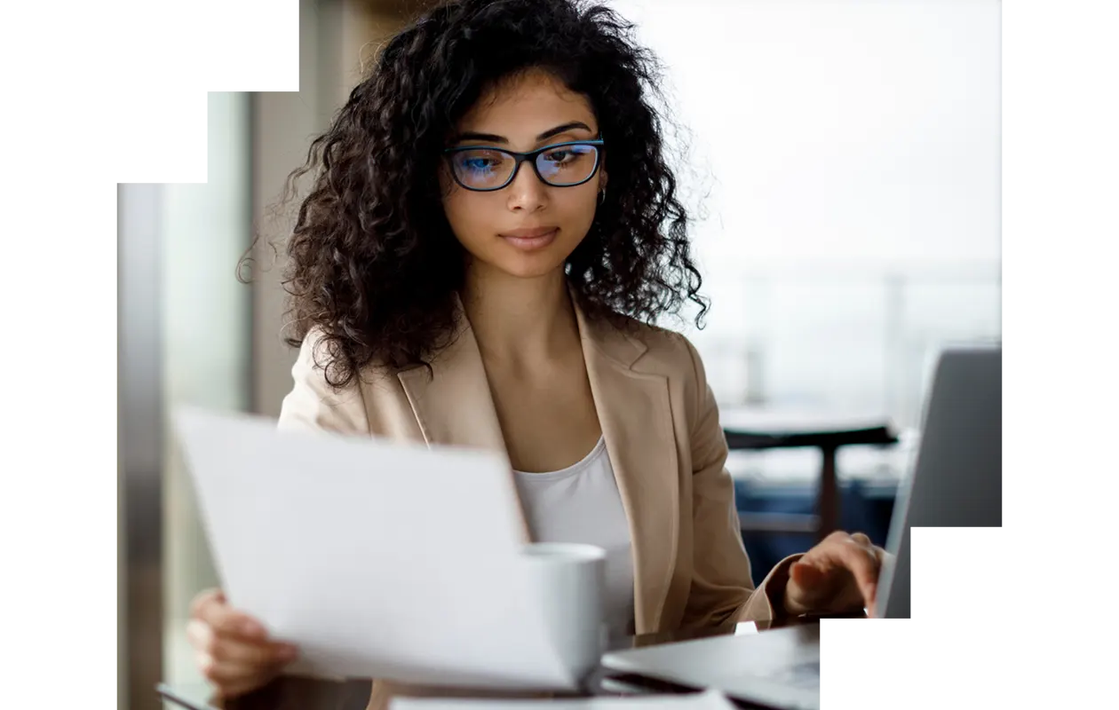 Woman using laptop in library