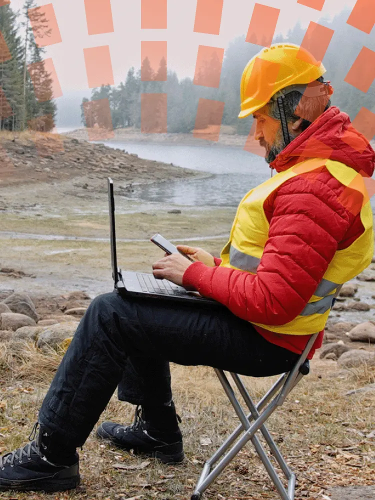 Man using laptop in remote area
