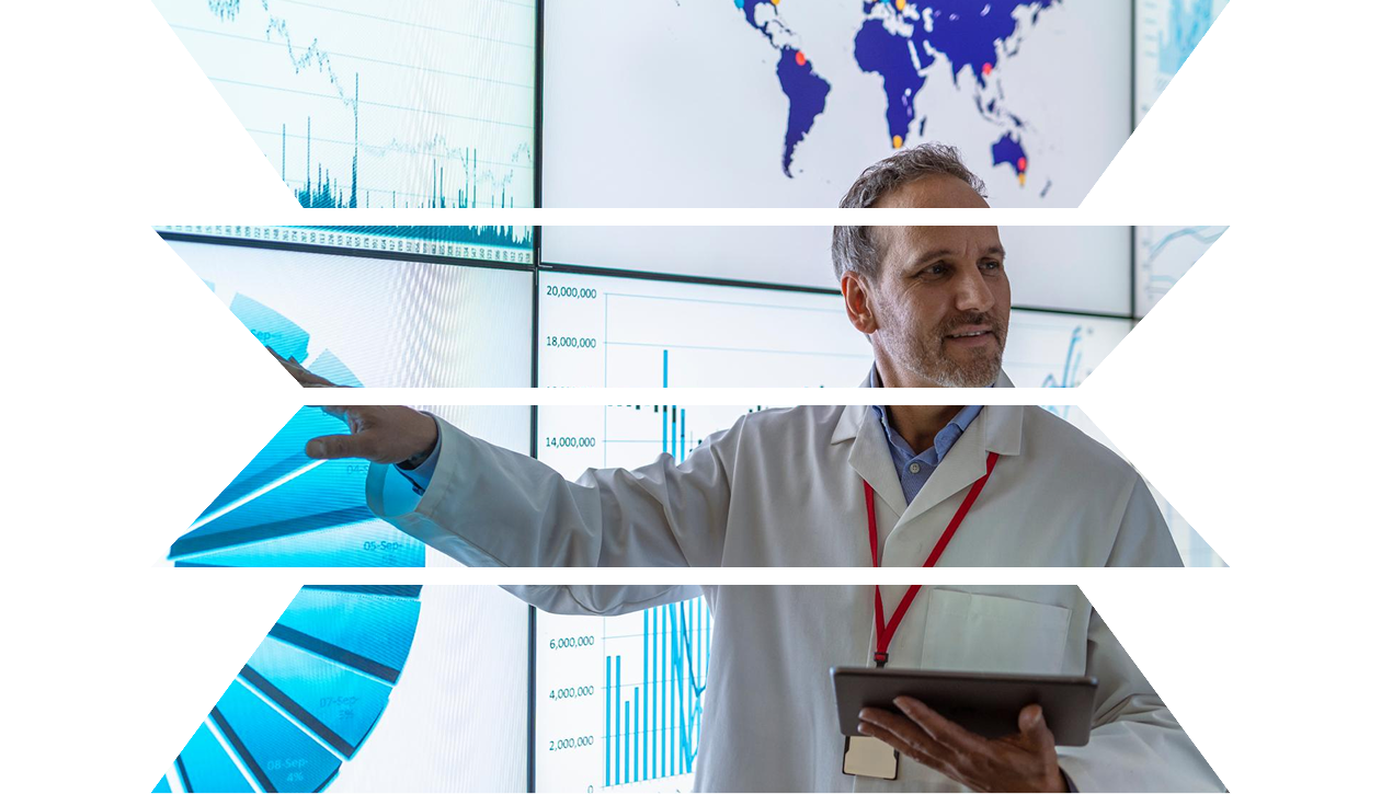 Researcher giving presentation with charts on interactive screens