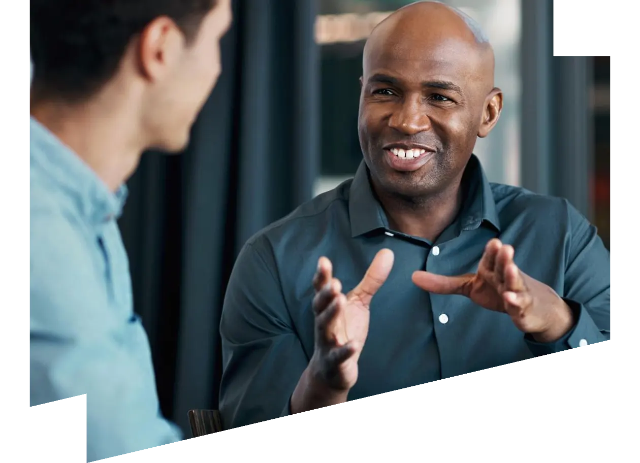Young African American explaining a business proposal to a colleague