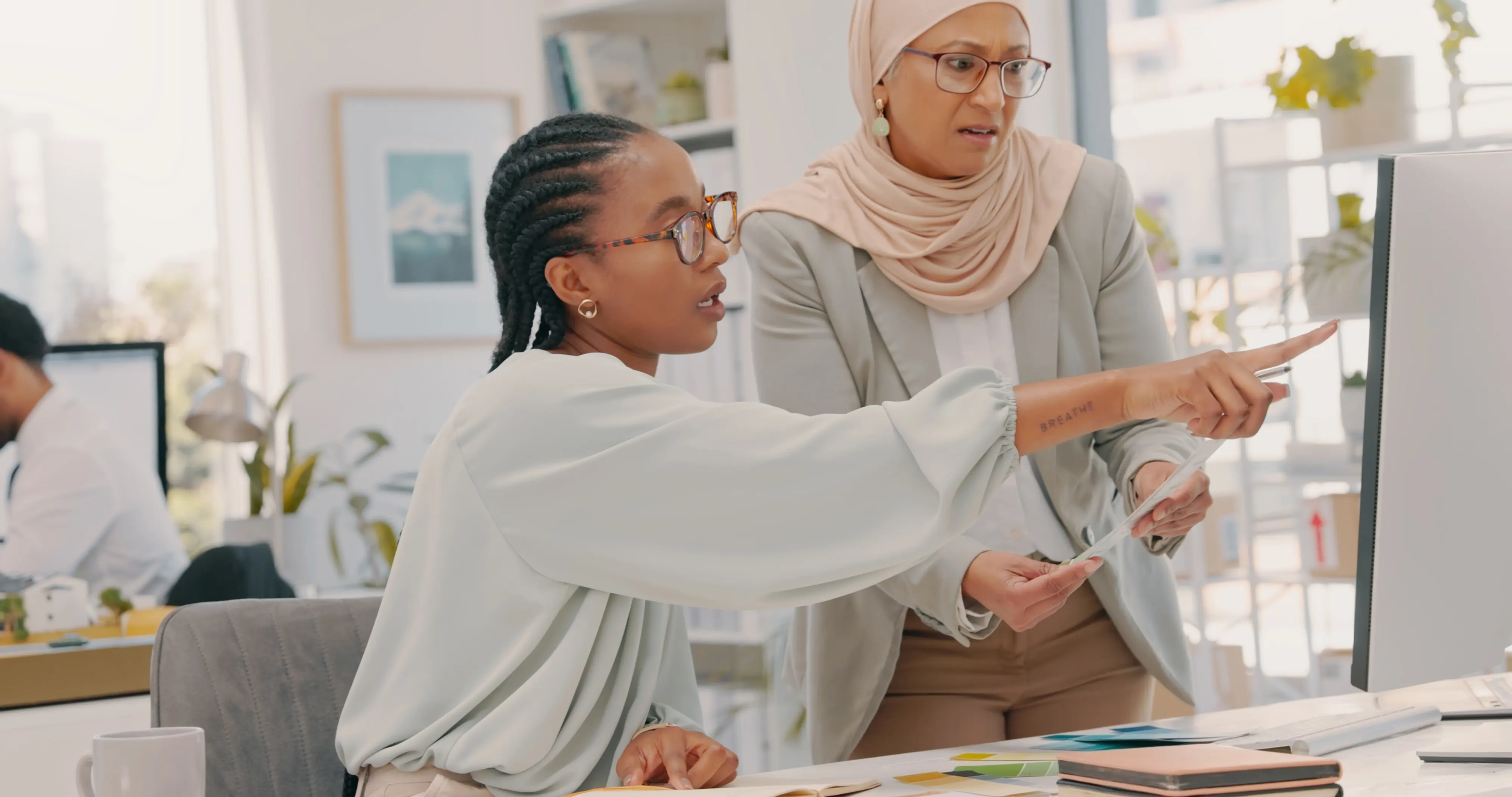 Computer, advice and diversity women planning for collaboration, ideas and workflow management. Business people, muslim employee and black woman at desktop technology in office