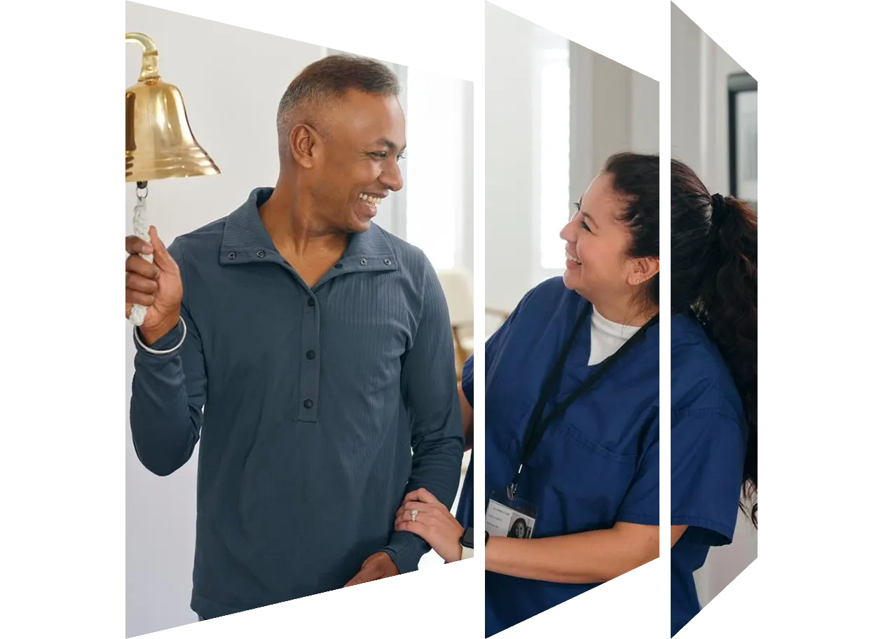 Male nurse pushing smiling senior woman in wheelchair