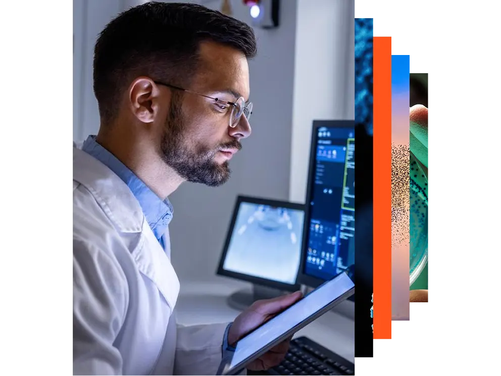 Young person working at a desk with multiple monitors