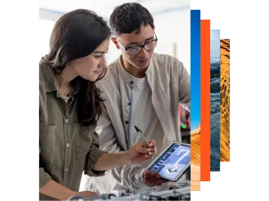 Two students building a robotic arm in a STEM class