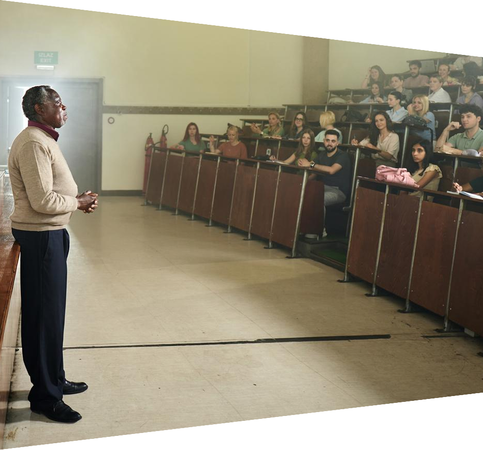 African-American male professor talking to large group of students in auditorium