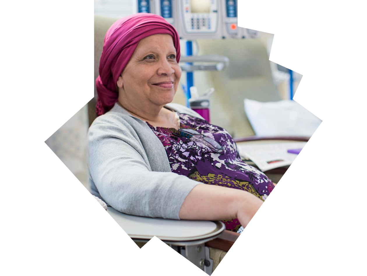 Smiling female patient in hospital infusion room