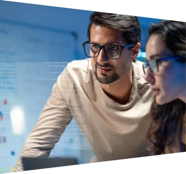 Researchers with tablet in front of screen with analytics 