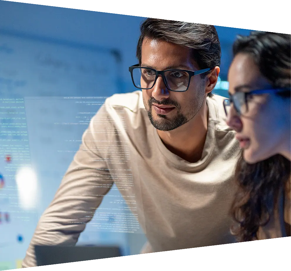 Researchers with tablet in front of screen with analytics 