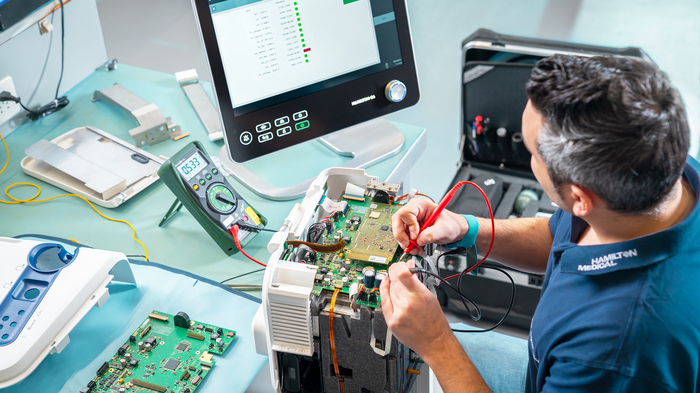 Tech Support employee servicing a HAMILTON-C6
